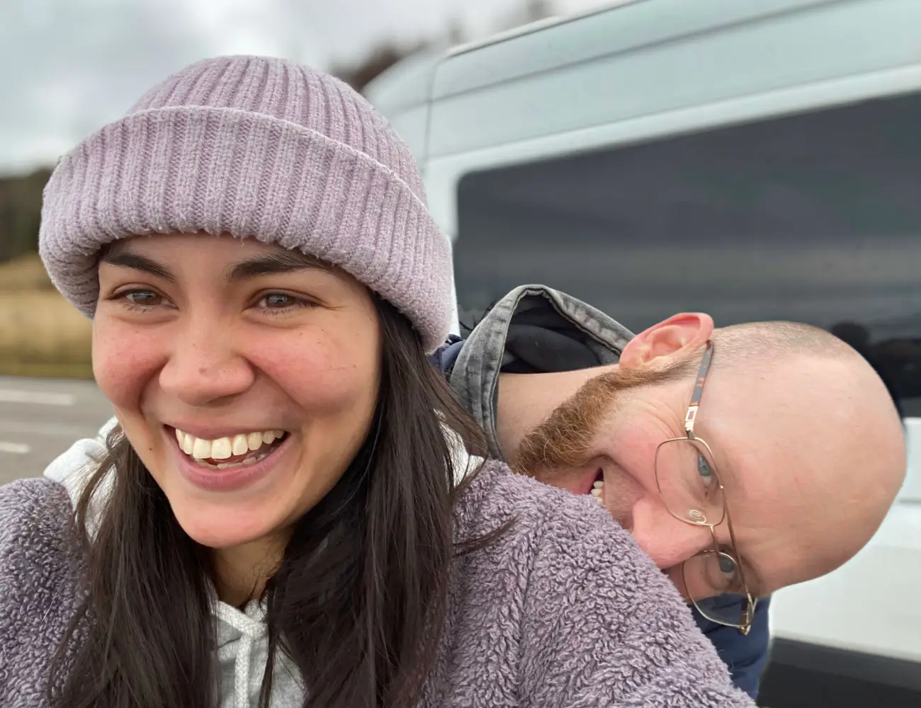 off-grid-odyssey-van-life-pets-happy-couple-outside-campervan