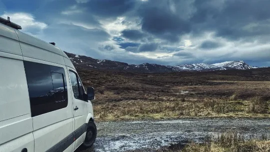 mercedes-sprinter-parked-in-highland-heather-on-stormy-night